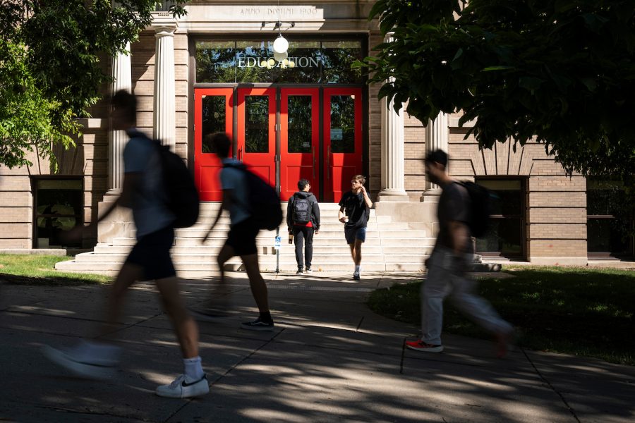 Decorative photo of UW students walk up Bascom Hill in front of the Education Building